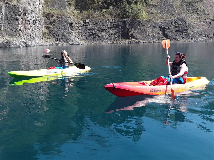 Two Kayak Girls On Water